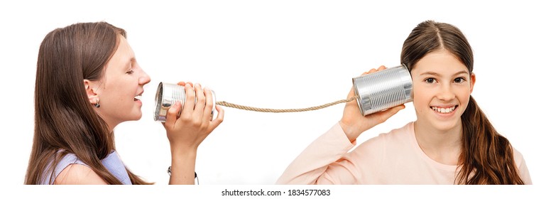 Positive Kid With A Tin Can Near The Ear, Playing The Phone. I Hear You Well, Child Isolated On White, Hearing Concept