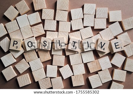Positive Letter Scrabble Alphabet Text. Think positive text written with scrabble alphabets.