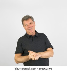 Positive Looking Fifty Year Old Man In Black Shirt