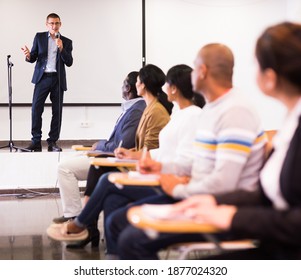 Positive Male Lecturer Speaking At Corporate Business Coaching And Training Conference