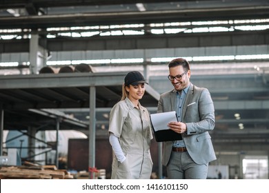 Positive Manager And Employee Talking At Manufacturing Factory.