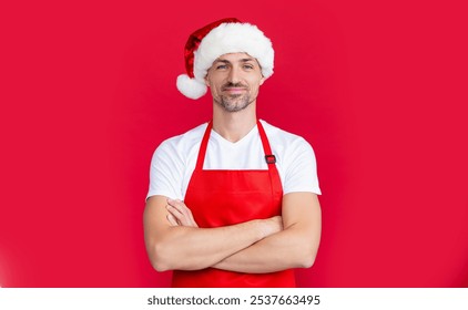 positive mature man in red barista apron and christmas santa hat - Powered by Shutterstock