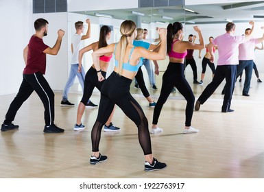 Positive Men And Ladies Dancing Aerobics At Lesson In The Dance Class