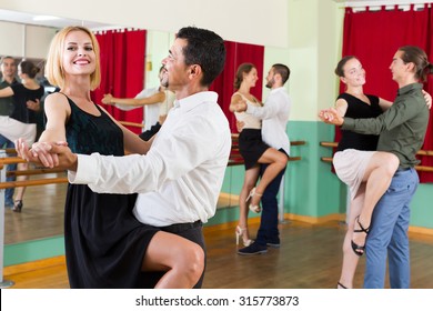 Positive Men And Women Enjoying Of Tango In Class 