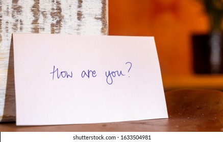 Positive Mental Health And Leading Questions To Ask Someone You Care About. How Are You? Are You Okay? How Was Your Day? Caring About Someone Else. Handwritten Note.