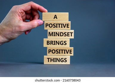 Positive Mindset Symbol. Wood Blocks With Words A Positive Mindset Brings Positive Results. Beautiful Grey Background Businessman Hand. Business Motivational Positive Mindset Concept. Copy Space.