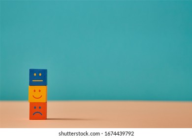 Positive, Negative, Neutral Emoji On Colorful Cubes. Emotions People. Positivity Or Negativity, Neutrality. Copy Space