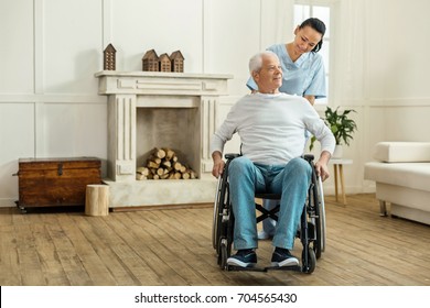 Positive Nice Man Moving Forward In The Wheelchair