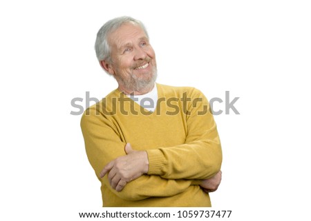 Positive old man looking up. Portrait of grandpa in sweater. White isolated background.