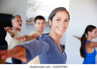 Positive outlook on health. A group of people taking a class together at gym. - Shutterstock ID 2141079401