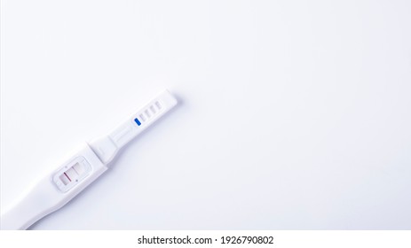 Positive Pregnancy Test On White Background. Copy Space