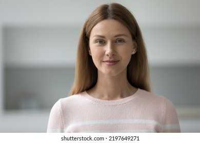 Positive Pretty Adult Female Model Head Shot Portrait. Beautiful Caucasian Woman With Natural Makeup, Long Brown Hair In Casual Looking At Camera, Posing At Home. Front Profile Picture