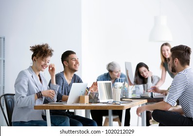 Positive relationships between smiling employees working in the corporation - Shutterstock ID 1020212029