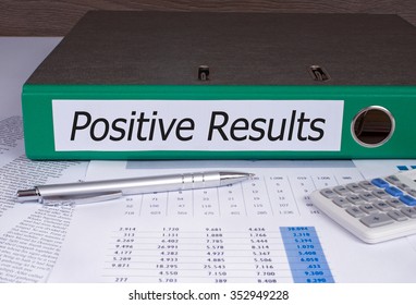 Positive Results Binder With Green Color On Desk In The Office