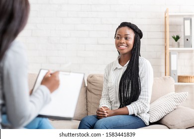 Positive Results Of Therapy. Happy African American Woman Sitting At Psychologist Office After Successful Session, Free Space