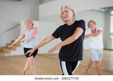 Positive senior women in sportswear dancing in fitness room. - Shutterstock ID 2081277733