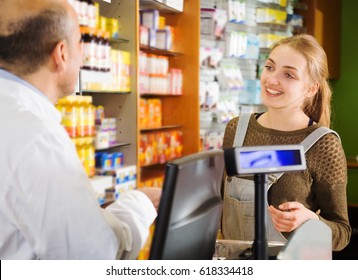 Positive Shopper Buys Medicine In A Pharmacy