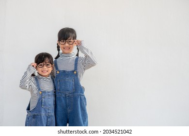 Positive Siblings In Similar Clothes