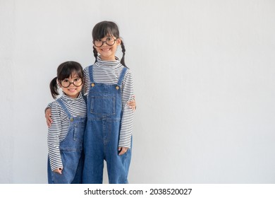 Positive Siblings In Similar Clothes