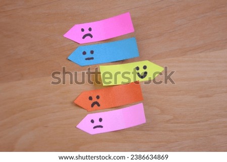 Positive Smiley Shines Among Sad Faces on Sticky Notes. Upholding Positivity Concept. Overcoming Sadness with Positivity.