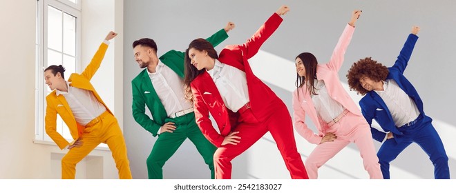 Positive and smiling group of young dancers in colorful business costumes dance together. The lively party is filled with music, colorful outfits, and a joyful crowd enjoying the dance. - Powered by Shutterstock