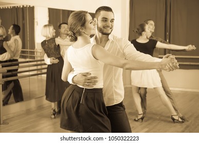 Positive Spanish Men And Women Enjoying Of Tango In Class