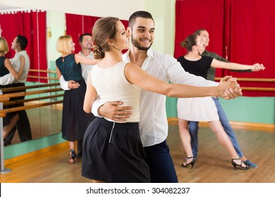 Positive Spanish Men And Women Enjoying Of Tango In Class 