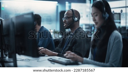 Positive Technical Support Manager Talking on a Call, Providing Help Desk Solutions to a Customer Experiencing Troubleshooting Issues with a Product. Happy African Man Successfully Solving the Problem