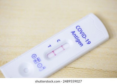 Positive test result  on home test kit. Corona or Covid-19 rapid tests for home testing. - Powered by Shutterstock