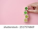 For positive thinking, added value, benefits, additional, personal development, growth mindset, positive thinking, opportunities, mental heath concept. emoticon face on stack of wooden cube blocks