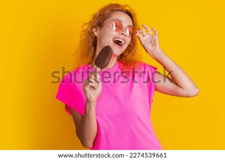 positive woman with icelolly ice cream on background. photo of woman with icelolly ice cream