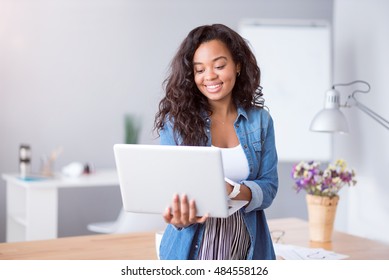 Positive Woman Using Laptop