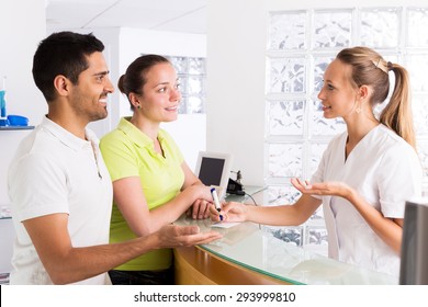 Positive Young Family In The Waiting Room Of The Clinic Family Planning