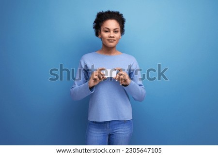 positive young latin 20c woman holding card mockup