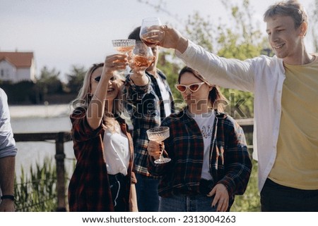 Similar – Mann öffnet Bierflasche am Sommergrill