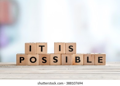 It is possible sign made of wooden cubes on a table - Shutterstock ID 388107694