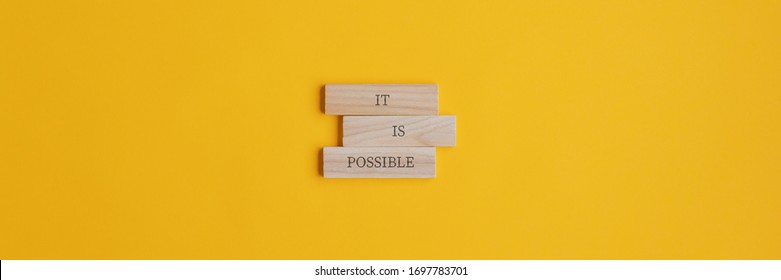 It is possible sign on stacked wooden pegs placed over yellow background. Wide view image with copy space.  - Shutterstock ID 1697783701