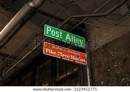 Post Alley and Pike Place Market directional signs at the gum wall in Seattle, Washington, USA