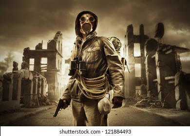 Post Apocalyptic Survivor In Gas Mask, Destroyed City In The Background