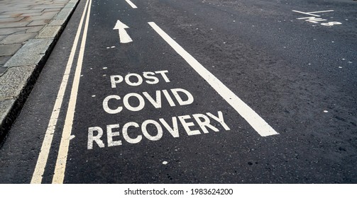 Post Covid Recovery written in a cycle lane city street