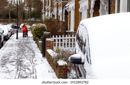 Post Man Working In Snow City