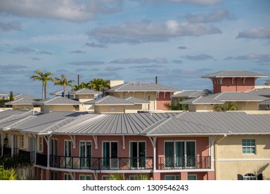 Post Modern Roof On The Building. Metal, TPO, BUR, Shingles Roof System. Roofing In Florida.