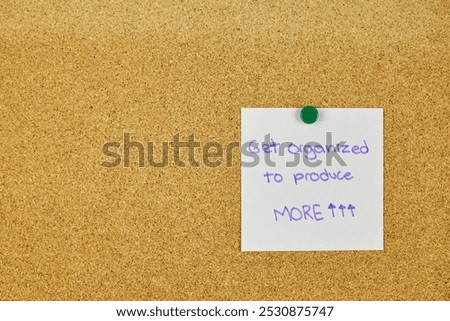 Post It notes with resolutions and goals achieved, placed on the cork board at the foot of a desk