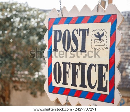 Post office sign in shape of postmark
