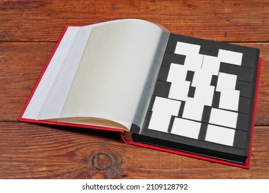 Postage stamps frames set in vintage album on wooden table - Powered by Shutterstock