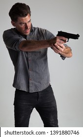 Post-Apocalyptic / Dystopian, Disaster Action Hero – Attractive Caucasian Male with Brown Hair, pointing gun