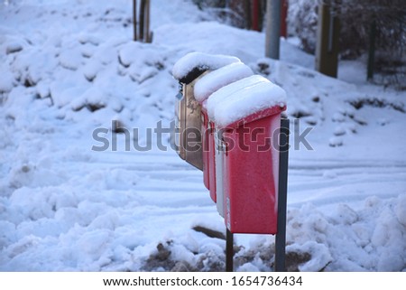 Postboxes in a row and snow
