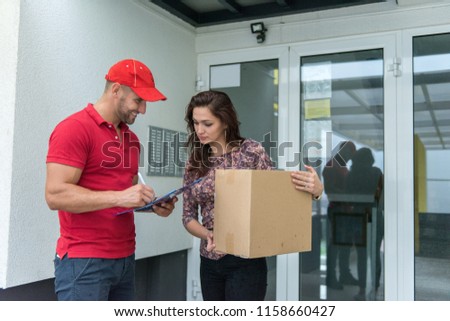 Postboy doing his job and delivering the items to his customer.