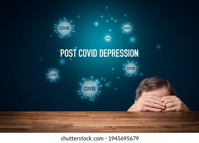 Post-Covid Depression Concept. Post Covid Mental Health Problems Concept. Man Hiding Himself In Hands Behind The Table And Text Post-Covid Depression.