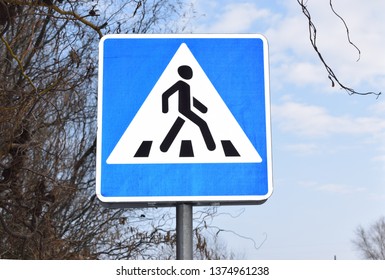 Posted sign in line with the convention on road sign, for informing of a pedestrian crossing - Shutterstock ID 1374961238